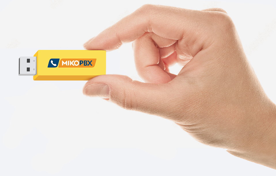 Hand holds the MikoPBX on flash card